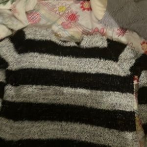 a black and grey knitted shirt